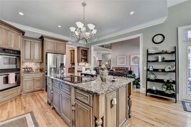 4478 Longmead Rd, Flowery Branch, GA 30542 - kitchen with stainless steel appliances, a kitchen island, light stone countertops, light wood finished floors, and decorative backsplash