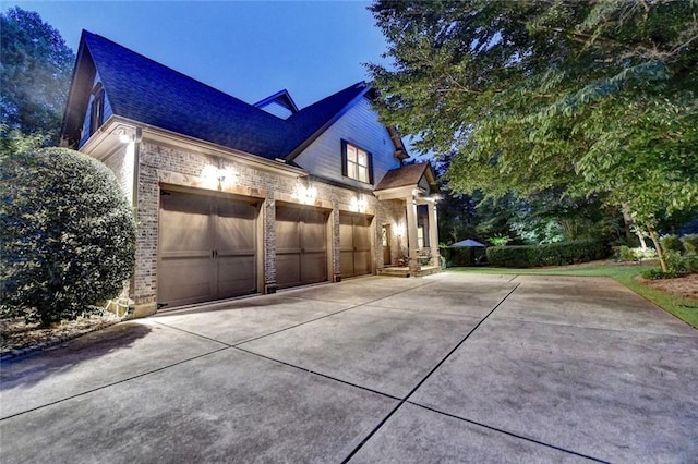 4478 Longmead Rd, Flowery Branch, GA 30542 - view of side of home featuring driveway, brick siding, a garage, and a shingled roof