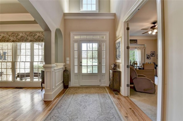 4478 Longmead Rd, Flowery Branch, GA 30542 - entryway with wood finished floors, plenty of natural light, crown molding, arched walkways, and a ceiling fan