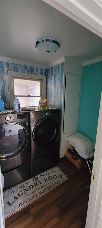 laundry area featuring laundry area, wood finished floors, and ornamental molding