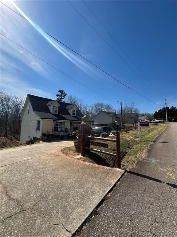 view of front of house featuring fence