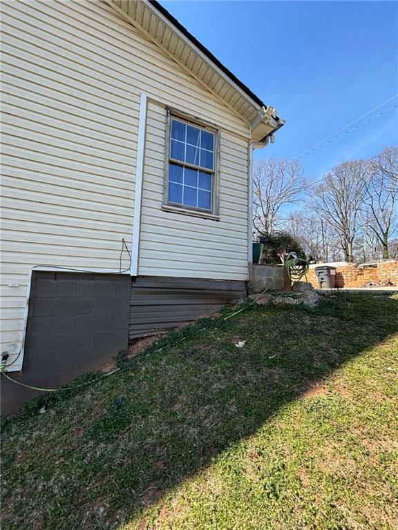 view of home's exterior featuring a lawn