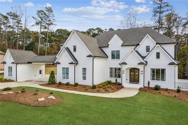 view of front of home featuring french doors and a front lawn