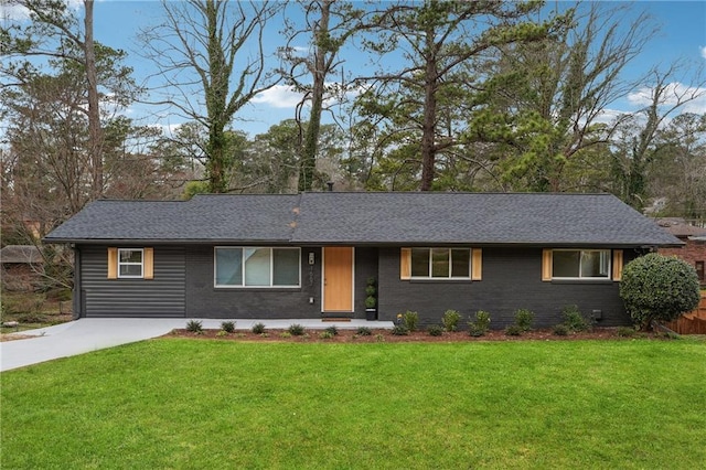 single story home with concrete driveway, brick siding, a front yard, and a shingled roof