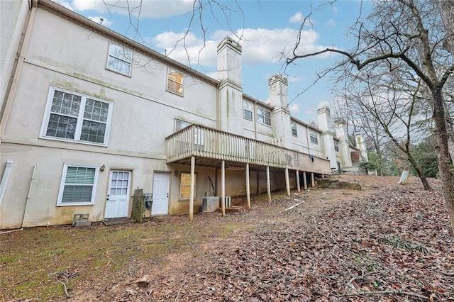 back of house featuring central air condition unit