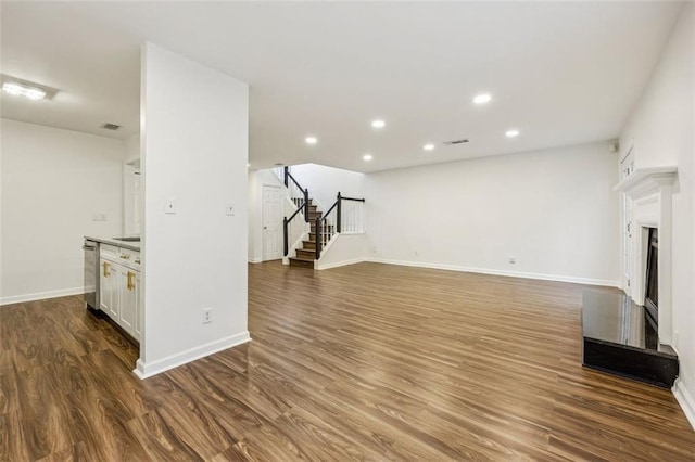 unfurnished living room featuring hardwood / wood-style flooring