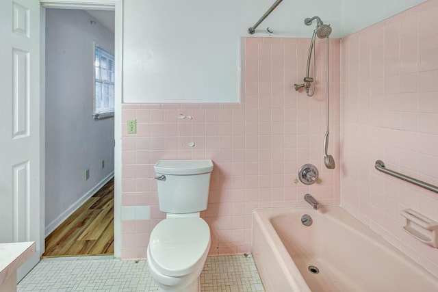 333 Lynne Cir, Alpharetta, GA 30009 - bathroom with shower / washtub combination, toilet, tile walls, and tile patterned flooring