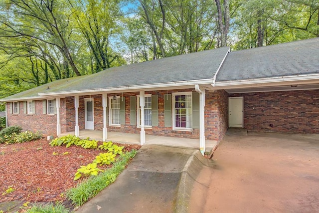 333 Lynne Cir, Alpharetta, GA 30009 - ranch-style home featuring a porch, brick siding, and an attached carport