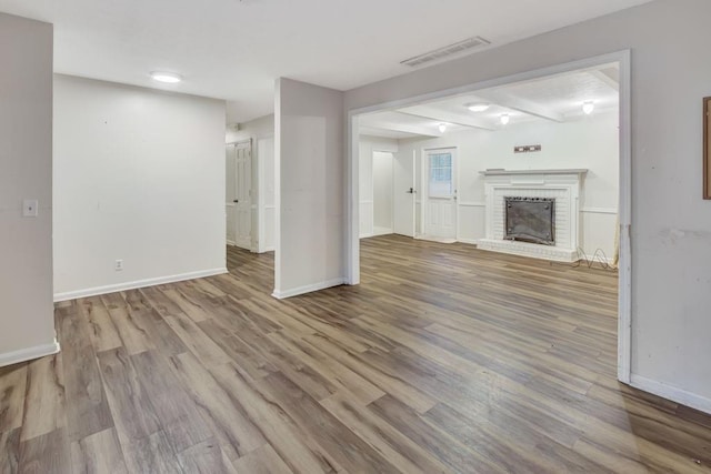 333 Lynne Cir, Alpharetta, GA 30009 - unfurnished living room featuring wood finished floors, baseboards, and a fireplace