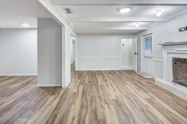 333 Lynne Cir, Alpharetta, GA 30009 - unfurnished living room with a fireplace, beam ceiling, wood finished floors, and baseboards