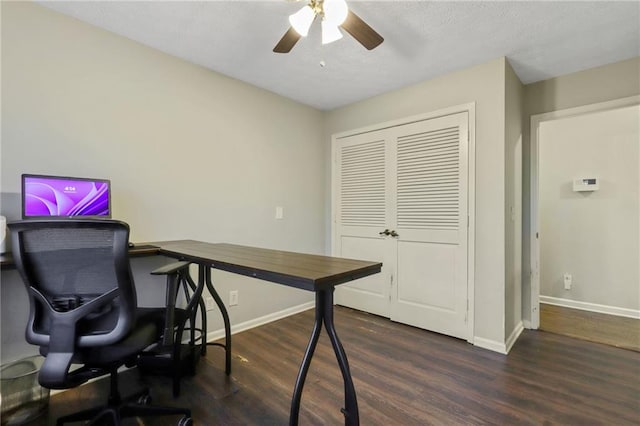 office space featuring ceiling fan, baseboards, and dark wood-style flooring