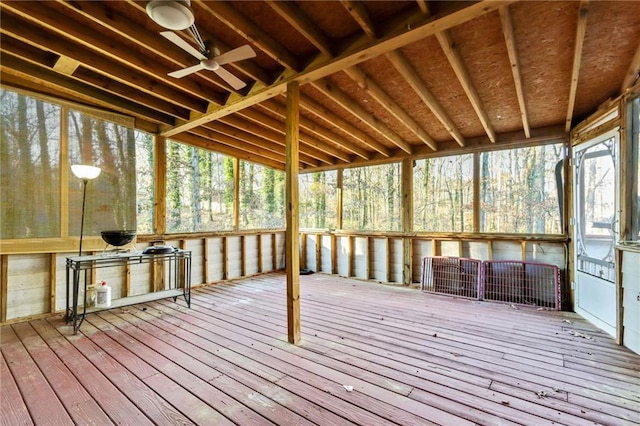 unfurnished sunroom featuring ceiling fan