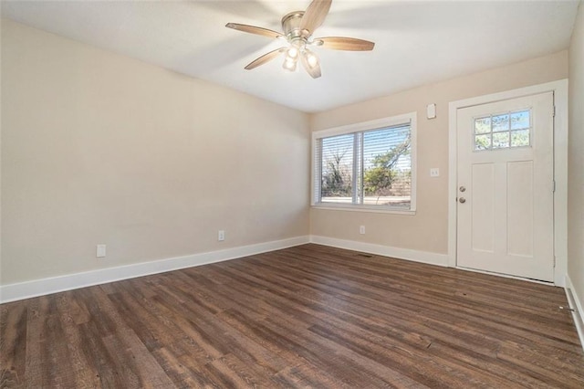 entryway featuring ceiling fan and dark wood-type flooring