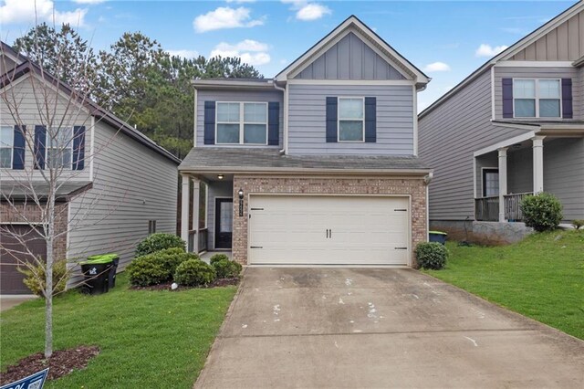 5456 Union Hill Ct, Union City, GA 30291 - craftsman inspired home with driveway, a front yard, a garage, and board and batten siding
