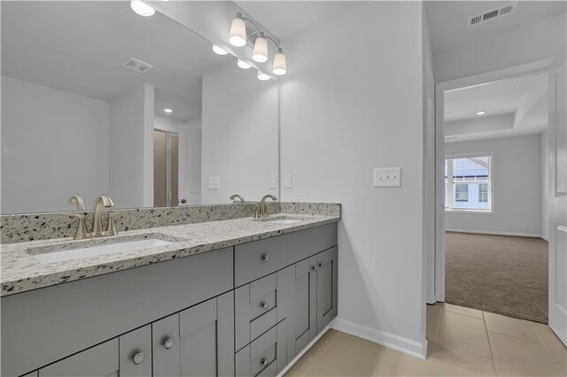 bathroom featuring vanity and tile patterned flooring