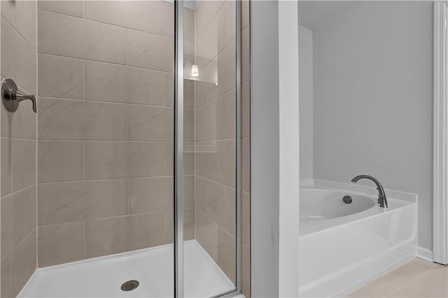 bathroom with shower with separate bathtub