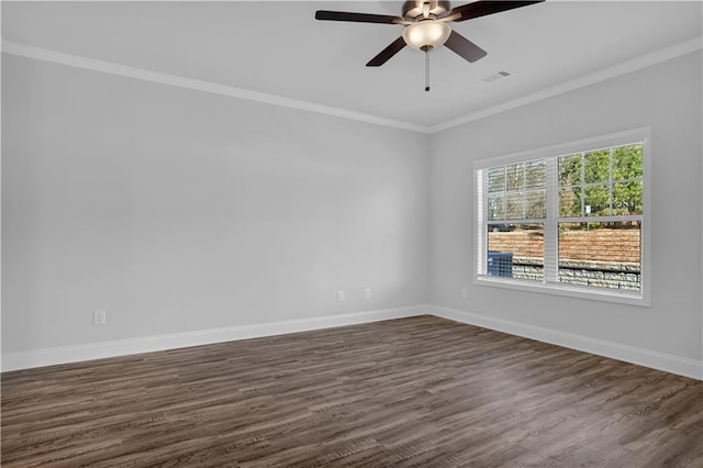 spare room with ornamental molding, dark wood-type flooring, and ceiling fan