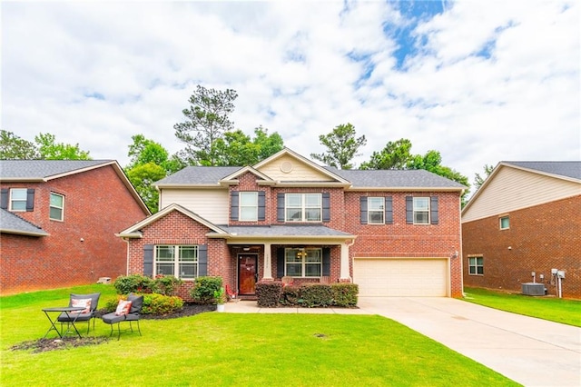 12275 Styron Dr, Hampton, GA 30228 - view of front of property with brick siding, an attached garage, concrete driveway, and a front yard