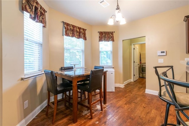 12275 Styron Dr, Hampton, GA 30228 - dining area featuring a chandelier, wood finished floors, and baseboards