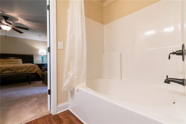 12275 Styron Dr, Hampton, GA 30228 - ensuite bathroom featuring a ceiling fan, shower / bath combination with curtain, wood finished floors, and ornamental molding