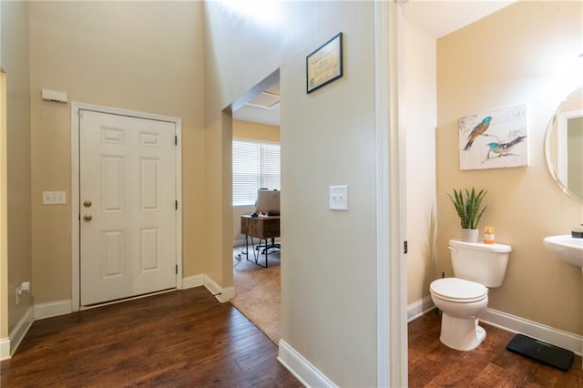 12275 Styron Dr, Hampton, GA 30228 - entrance foyer featuring dark wood-type flooring and baseboards