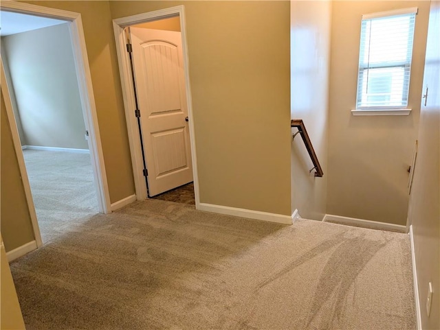 stairs with carpet flooring and baseboards