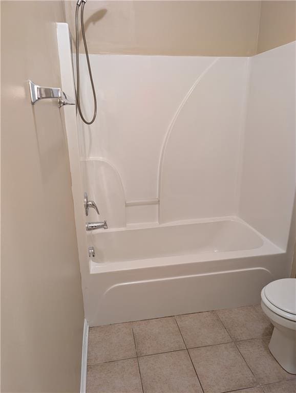 full bathroom with tile patterned floors, toilet, and shower / tub combination