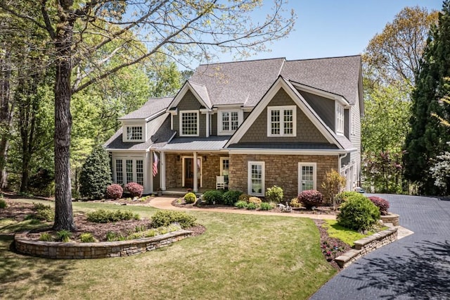 803 Night Fire Dr, Dawsonville, GA 30534 - craftsman-style home featuring a front lawn, roof with shingles, driveway, and covered porch