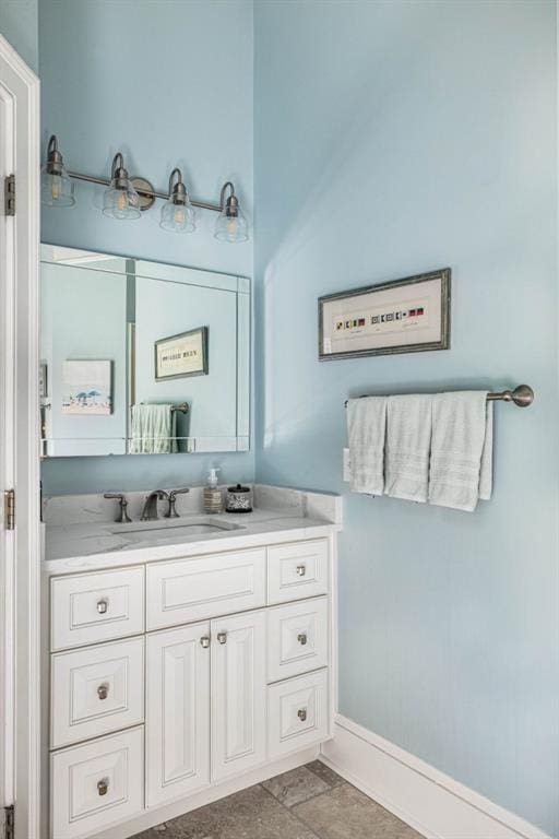 803 Night Fire Dr, Dawsonville, GA 30534 - bathroom featuring baseboards, stone finish floor, and vanity