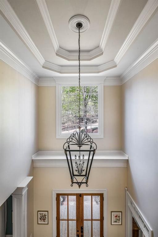 803 Night Fire Dr, Dawsonville, GA 30534 - details featuring a tray ceiling, crown molding, french doors, and an inviting chandelier