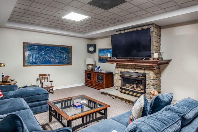 803 Night Fire Dr, Dawsonville, GA 30534 - carpeted living area featuring a raised ceiling, a stone fireplace, baseboards, and a paneled ceiling