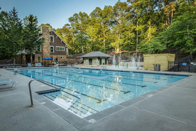 803 Night Fire Dr, Dawsonville, GA 30534 - community pool with a patio area and fence