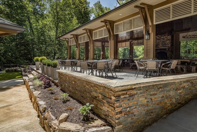 803 Night Fire Dr, Dawsonville, GA 30534 - view of patio / terrace featuring an outdoor stone fireplace and outdoor dining space