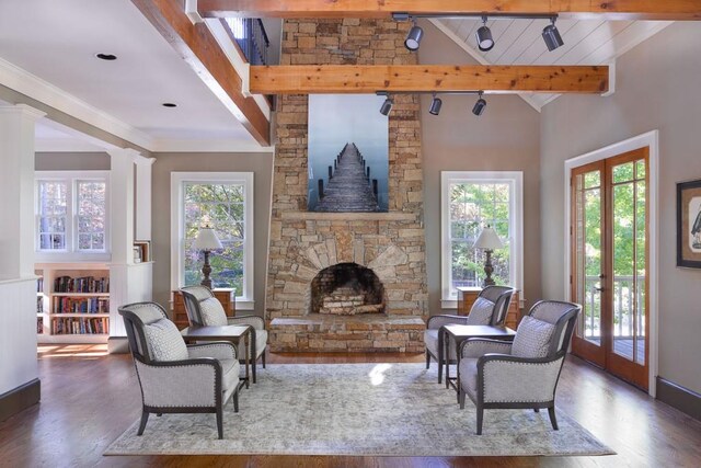 803 Night Fire Dr, Dawsonville, GA 30534 - living room featuring a stone fireplace, a wealth of natural light, wood finished floors, and ornate columns