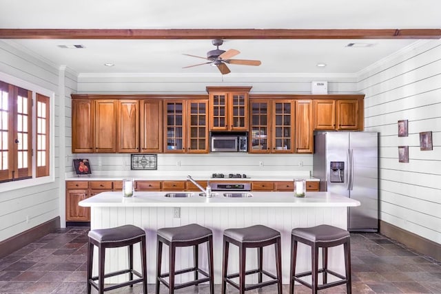 803 Night Fire Dr, Dawsonville, GA 30534 - kitchen with a sink, brown cabinetry, stainless steel appliances, light countertops, and stone finish floor