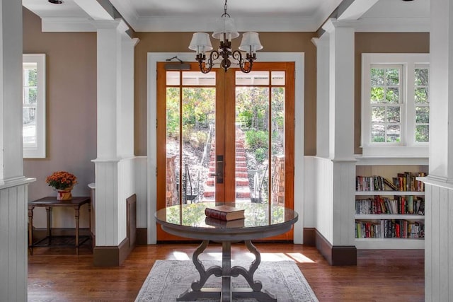 803 Night Fire Dr, Dawsonville, GA 30534 - entryway with crown molding, wood finished floors, plenty of natural light, a chandelier, and decorative columns