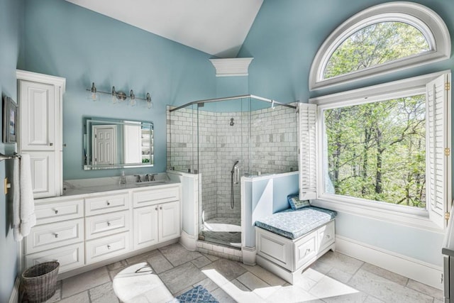 803 Night Fire Dr, Dawsonville, GA 30534 - full bath with a shower stall, vaulted ceiling, a healthy amount of sunlight, and vanity
