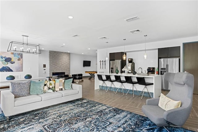 tiled living room with a large fireplace