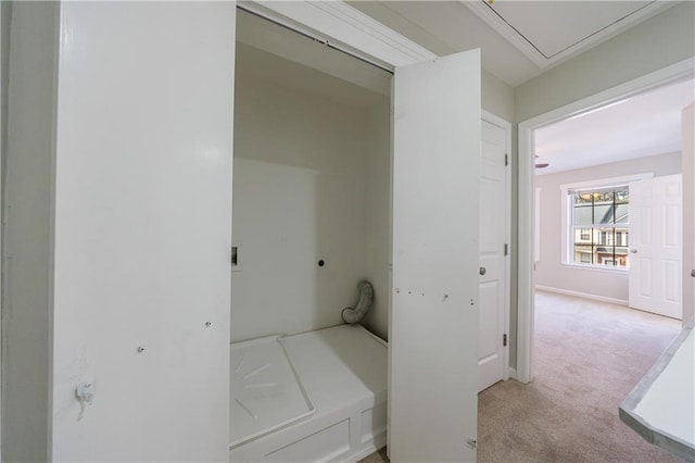 corridor with baseboards and light colored carpet