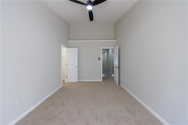 unfurnished bedroom with ceiling fan, baseboards, and carpet flooring