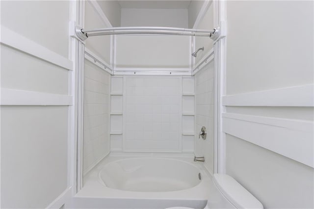 bathroom featuring toilet and bathtub / shower combination