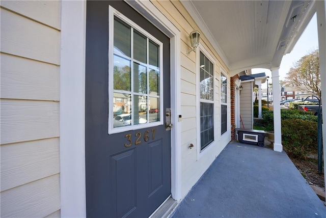 property entrance featuring covered porch