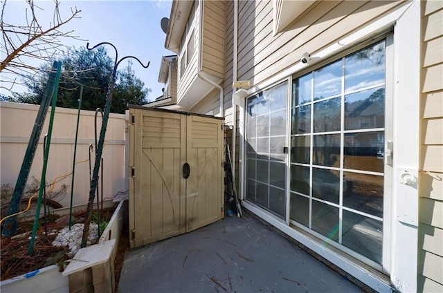 view of side of home with fence