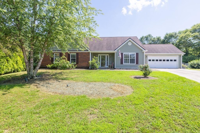 1490 Twin Manor Dr, Loganville, GA 30052 - ranch-style house with driveway, an attached garage, and a front lawn