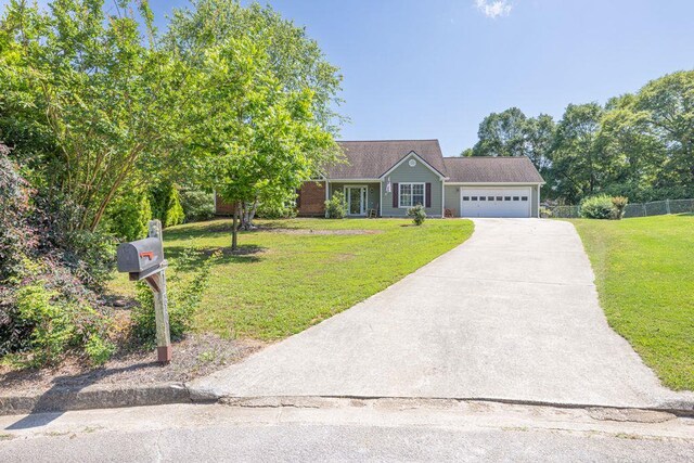 1490 Twin Manor Dr, Loganville, GA 30052 - view of front of house featuring an attached garage and concrete driveway
