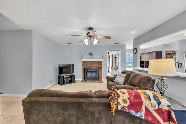 1490 Twin Manor Dr, Loganville, GA 30052 - living area with light colored carpet, a ceiling fan, a textured ceiling, a brick fireplace, and baseboards