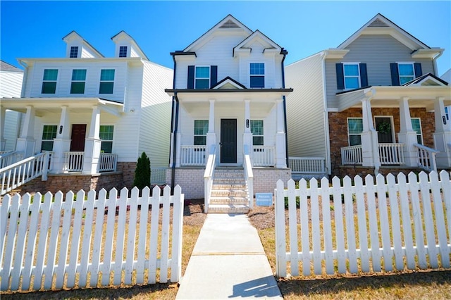 458 Bishop Ln, Woodstock, GA 30188 - view of front of property featuring a porch, a fenced front yard, and brick siding
