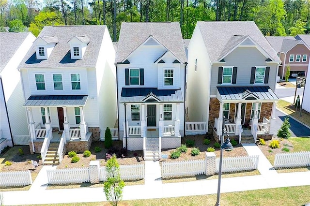 458 Bishop Ln, Woodstock, GA 30188 - view of front of house featuring a porch, a standing seam roof, stone siding, metal roof, and a shingled roof