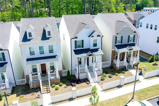 458 Bishop Ln, Woodstock, GA 30188 - view of front of home featuring covered porch, a standing seam roof, a residential view, and stone siding