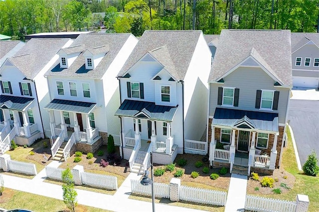 458 Bishop Ln, Woodstock, GA 30188 - view of front facade featuring a porch, a standing seam roof, a fenced front yard, and metal roof